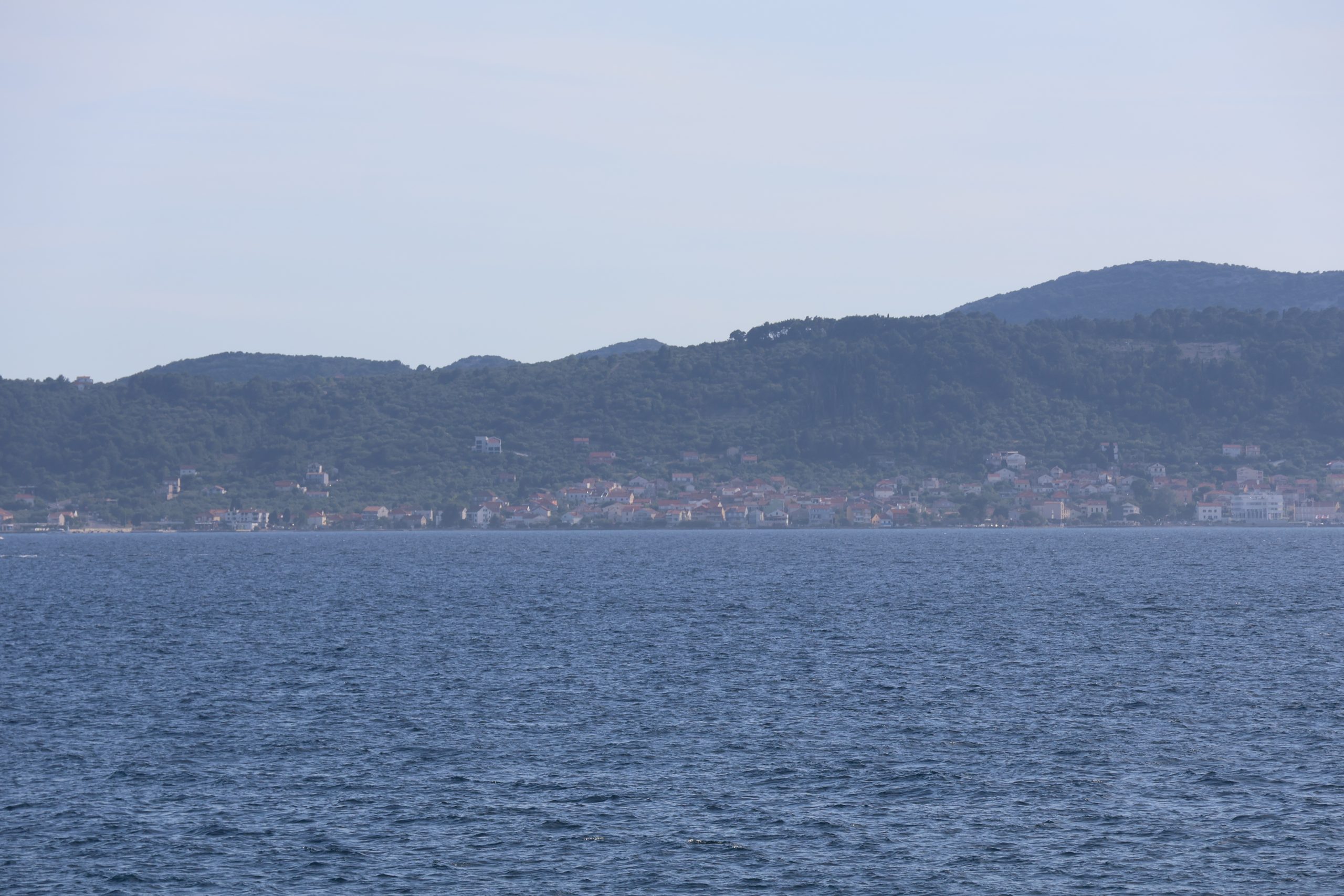 Distant houses across the Adriatic water near Zadar.