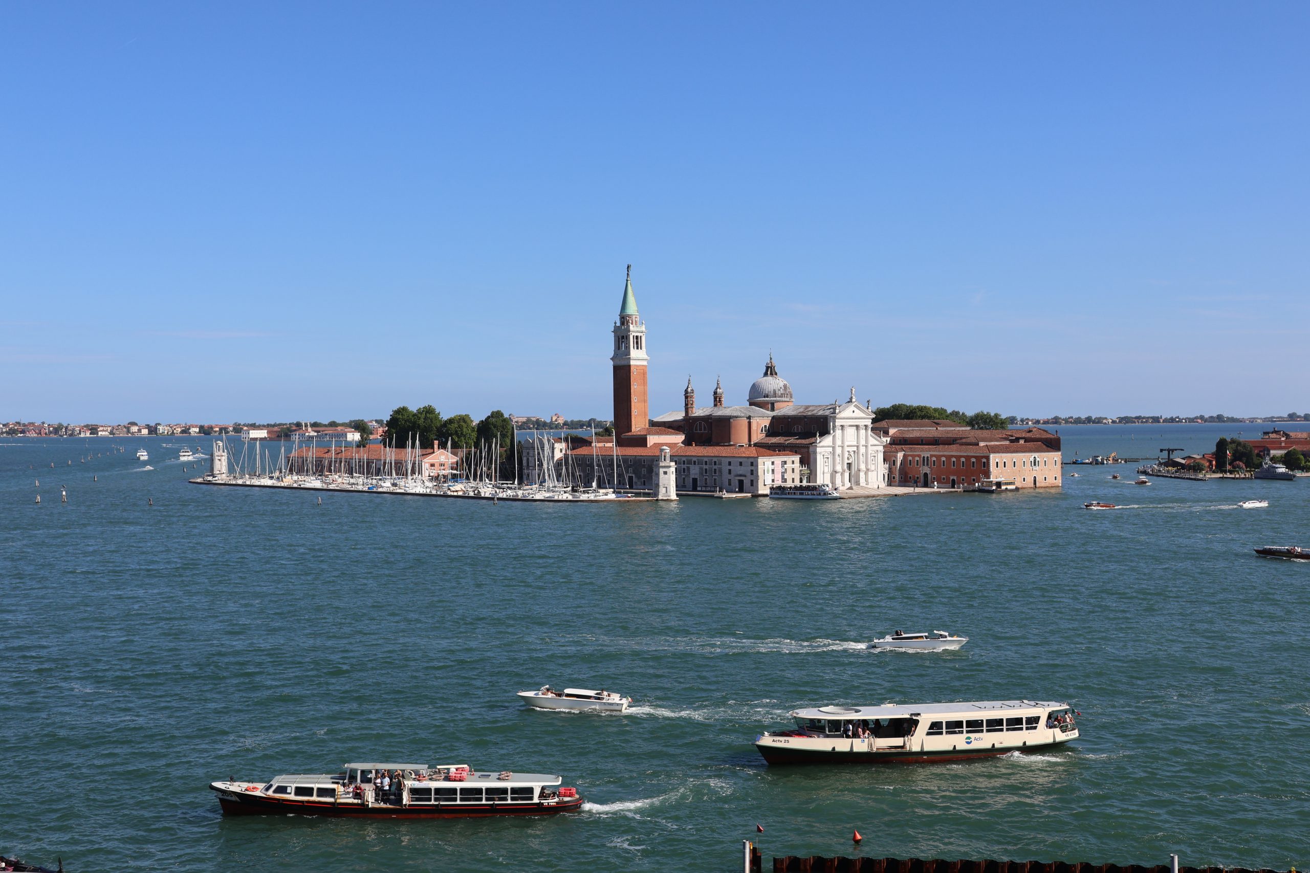 Venice's Grand Canal lined with historic buildings and boats.