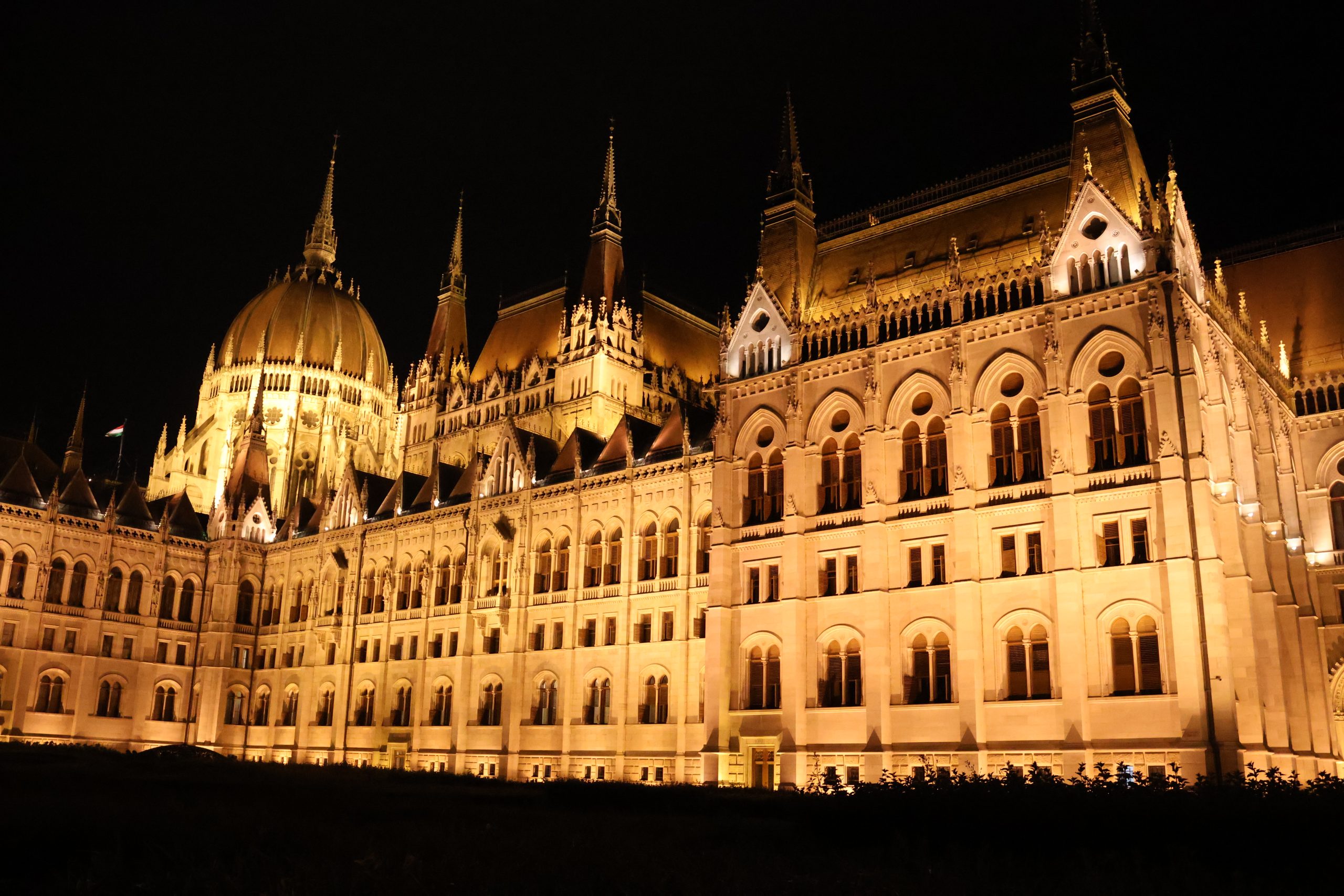 The illuminated Hungarian Parliament Building in Budapest at night.