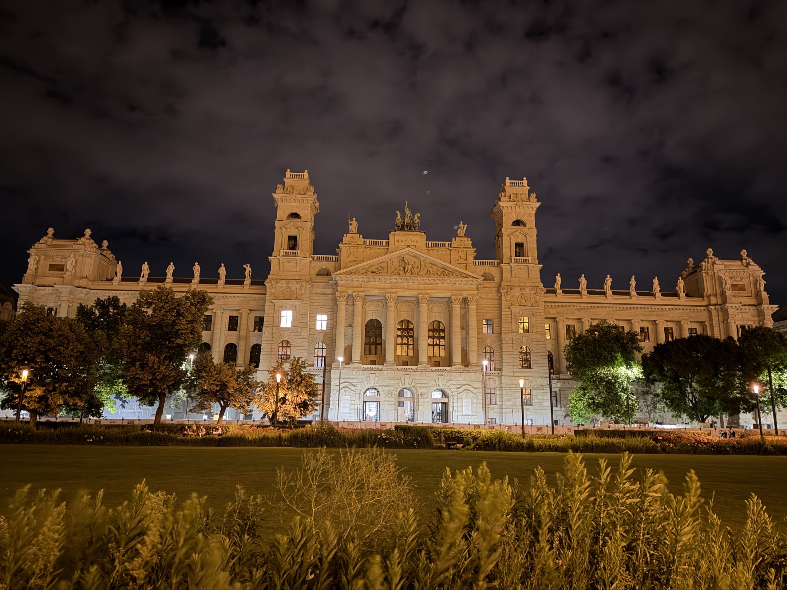The illuminated Palace of Justice in Budapest at night.